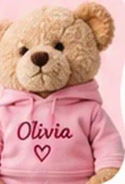 Teddy bear in a pink hoodie embroidered with the name Olivia