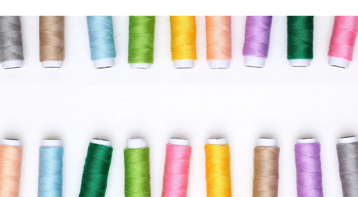 Rows of colourful embroidery thread reels