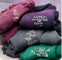 Stack of embroidered hoodies in different colours