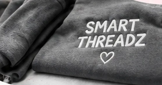 Grey sweatshirt embroidered with Smart ThreadZ and a heart
